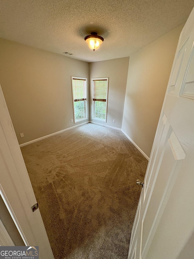 237 Shockley Way, Dallas, GA 30157 - carpeted spare room with baseboards and a textured ceiling