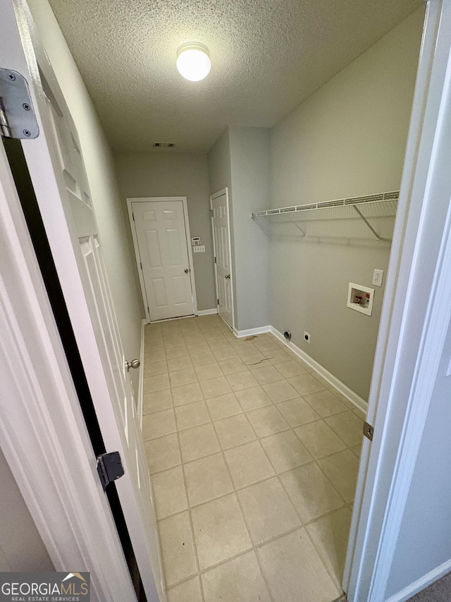 237 Shockley Way, Dallas, GA 30157 - washroom with washer hookup, a textured ceiling, light tile patterned floors, and gas dryer hookup