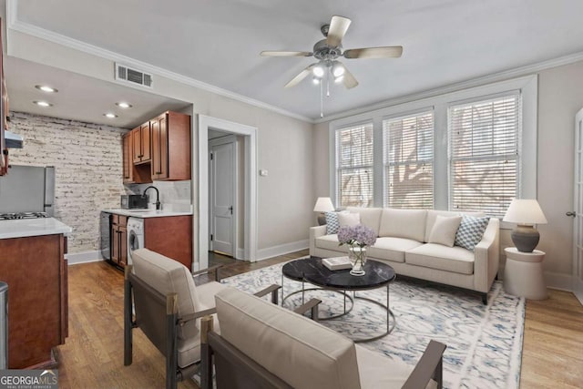 733 Frederica St NE Unit 7, Atlanta, GA 30306 - living room with light wood-style flooring, ornamental molding, and ceiling fan