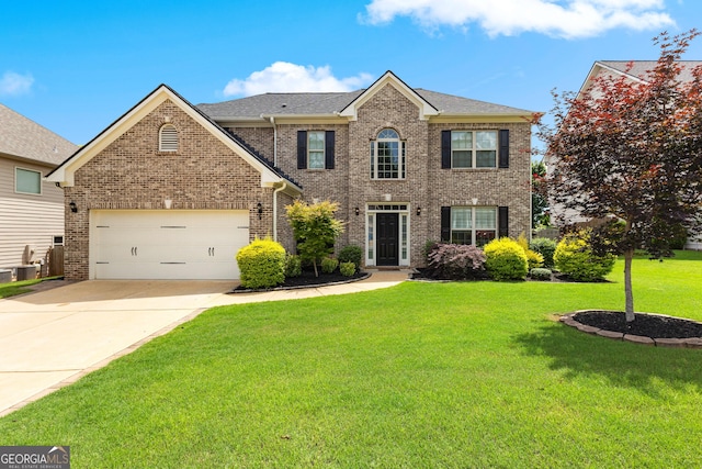 51 Stonebridge Way, Newnan, GA 30265 - view of front of house featuring a front yard, driveway, brick siding, and roof with shingles