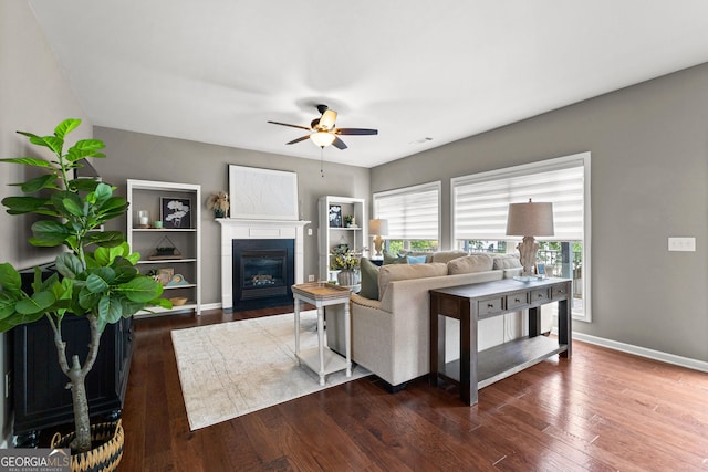 51 Stonebridge Way, Newnan, GA 30265 - living room featuring a ceiling fan, hardwood / wood-style flooring, and a glass covered fireplace