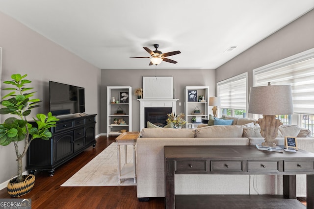 51 Stonebridge Way, Newnan, GA 30265 - living area with a ceiling fan, dark wood-style floors, and a glass covered fireplace