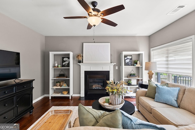 51 Stonebridge Way, Newnan, GA 30265 - living room featuring a ceiling fan, a fireplace with flush hearth, and wood finished floors