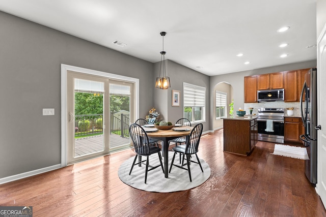 51 Stonebridge Way, Newnan, GA 30265 - dining room featuring arched walkways, dark wood-style flooring, and recessed lighting