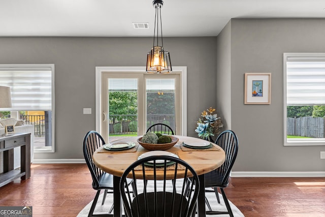 51 Stonebridge Way, Newnan, GA 30265 - dining area with plenty of natural light and dark wood-style floors