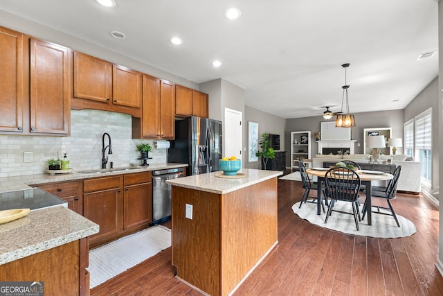 51 Stonebridge Way, Newnan, GA 30265 - kitchen featuring fridge with ice dispenser, dishwasher, brown cabinets, and recessed lighting