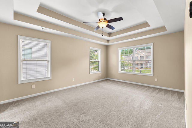 51 Stonebridge Way, Newnan, GA 30265 - carpeted empty room with a raised ceiling and ceiling fan
