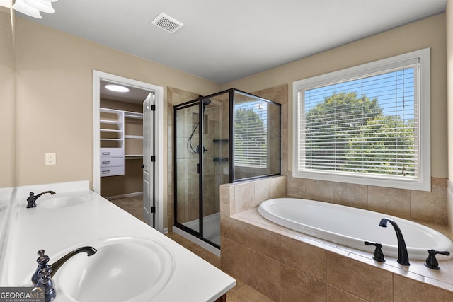 51 Stonebridge Way, Newnan, GA 30265 - bathroom with a stall shower, a bath, double vanity, and a spacious closet