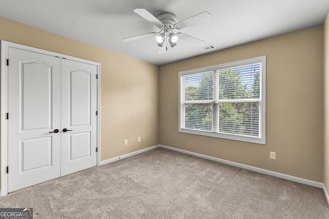 51 Stonebridge Way, Newnan, GA 30265 - unfurnished bedroom featuring carpet, a closet, and a ceiling fan