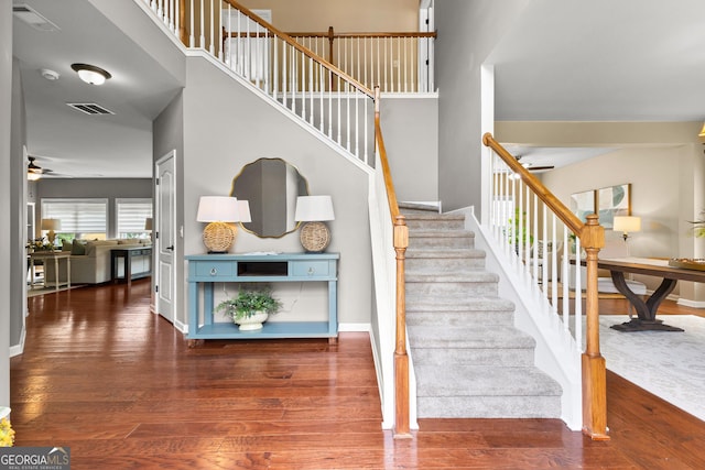 51 Stonebridge Way, Newnan, GA 30265 - stairs featuring ceiling fan and wood finished floors
