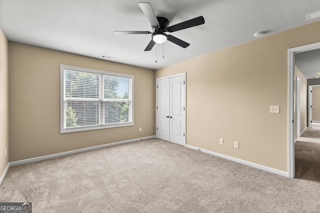 51 Stonebridge Way, Newnan, GA 30265 - unfurnished bedroom featuring carpet flooring, a closet, and a ceiling fan