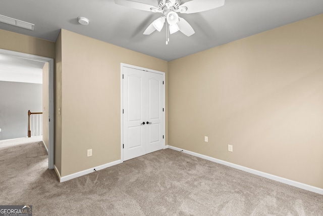 51 Stonebridge Way, Newnan, GA 30265 - unfurnished bedroom featuring carpet, ceiling fan, and a closet