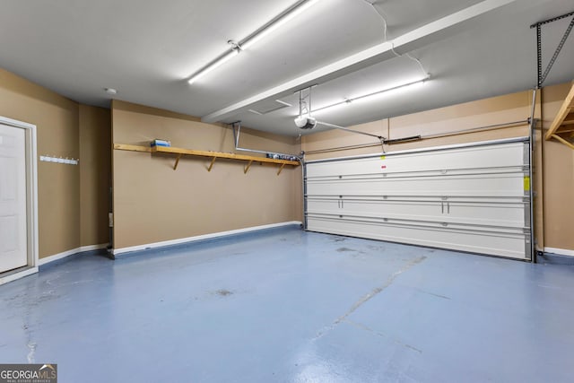 51 Stonebridge Way, Newnan, GA 30265 - garage with baseboards and a garage door opener