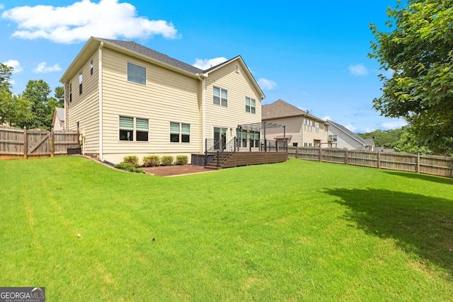 51 Stonebridge Way, Newnan, GA 30265 - back of house with a fenced backyard, stairway, and a wooden deck