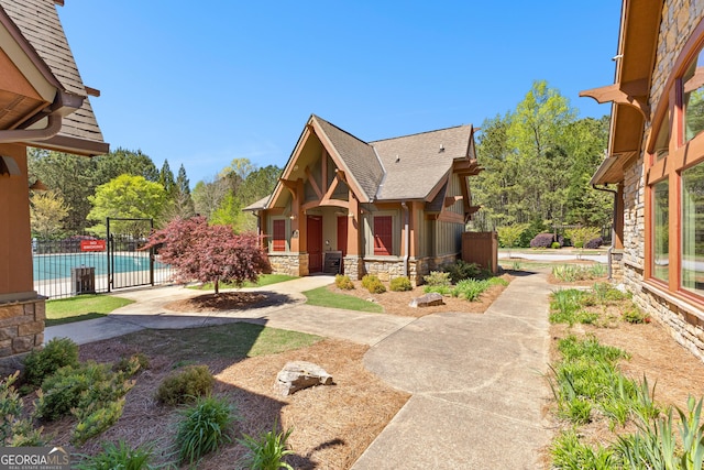 51 Stonebridge Way, Newnan, GA 30265 - view of front facade featuring stone siding and a shingled roof
