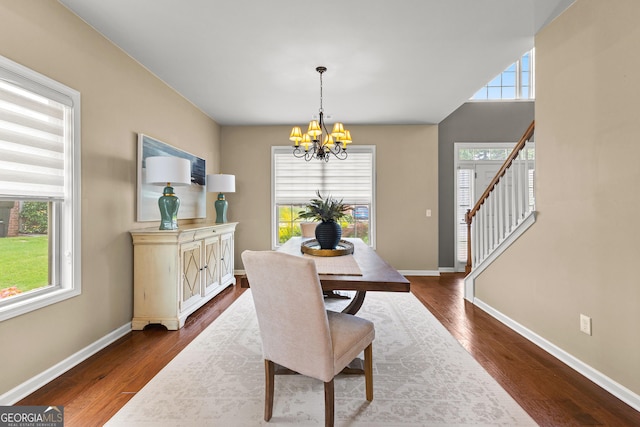 51 Stonebridge Way, Newnan, GA 30265 - dining area featuring a chandelier, dark wood finished floors, and stairway
