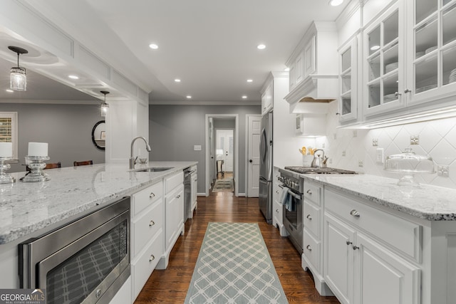 2240 Six Branches Dr, Roswell, GA 30076 - kitchen featuring stainless steel appliances, white cabinetry, tasteful backsplash, recessed lighting, and glass insert cabinets
