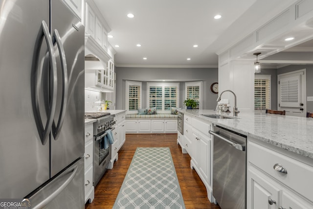 2240 Six Branches Dr, Roswell, GA 30076 - kitchen with appliances with stainless steel finishes, white cabinets, recessed lighting, crown molding, and light stone counters