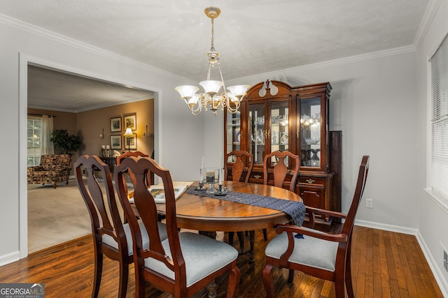 2240 Six Branches Dr, Roswell, GA 30076 - dining space featuring a chandelier, dark wood finished floors, and ornamental molding