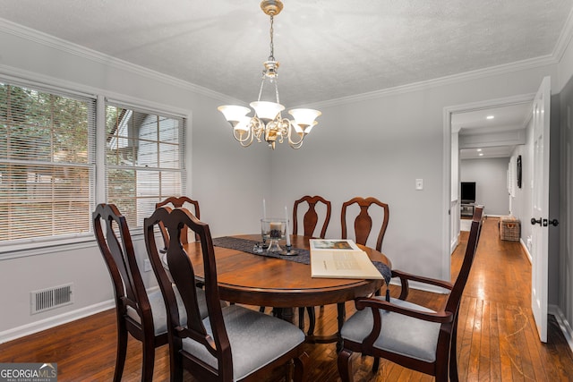 2240 Six Branches Dr, Roswell, GA 30076 - dining room featuring a chandelier, hardwood / wood-style floors, and ornamental molding