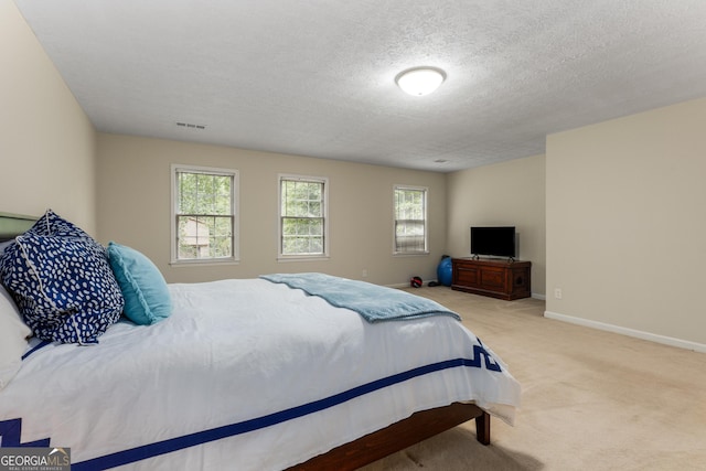 2240 Six Branches Dr, Roswell, GA 30076 - carpeted bedroom with a textured ceiling
