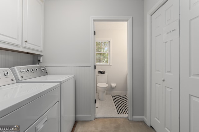 2240 Six Branches Dr, Roswell, GA 30076 - laundry area featuring washer and dryer, a wainscoted wall, cabinet space, wooden walls, and light colored carpet