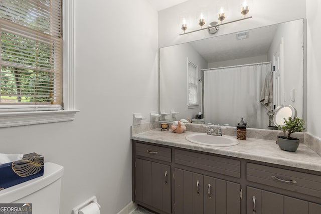 2240 Six Branches Dr, Roswell, GA 30076 - full bathroom featuring healthy amount of natural light and vanity