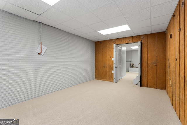 2240 Six Branches Dr, Roswell, GA 30076 - finished basement with carpet, a paneled ceiling, and wooden walls