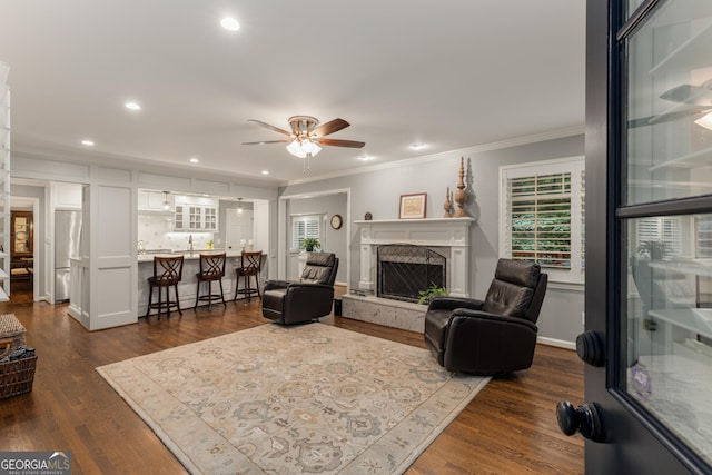 2240 Six Branches Dr, Roswell, GA 30076 - living area featuring a ceiling fan, ornamental molding, healthy amount of natural light, a fireplace with raised hearth, and recessed lighting