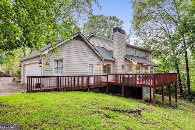 2240 Six Branches Dr, Roswell, GA 30076 - back of house featuring a deck, a yard, a chimney, and an attached garage