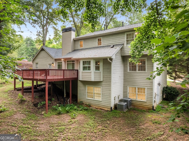 2240 Six Branches Dr, Roswell, GA 30076 - back of house featuring a deck, a chimney, and a shingled roof