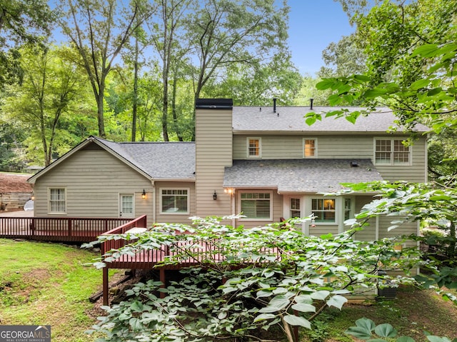 2240 Six Branches Dr, Roswell, GA 30076 - rear view of property featuring a shingled roof, a deck, and a chimney