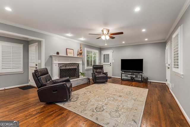 2240 Six Branches Dr, Roswell, GA 30076 - living area featuring a fireplace with raised hearth, ceiling fan, dark wood finished floors, recessed lighting, and crown molding