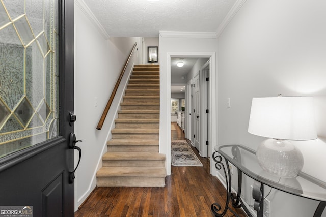 2240 Six Branches Dr, Roswell, GA 30076 - staircase featuring wood finished floors, ornamental molding, and a textured ceiling