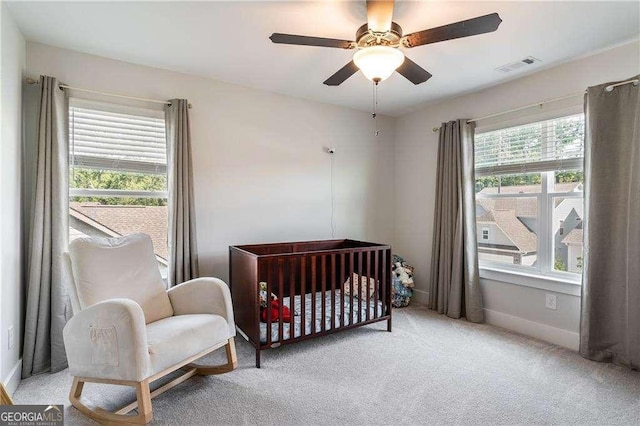 338 Boundless Ln, Canton, GA 30114 - bedroom featuring light colored carpet, a nursery area, and ceiling fan