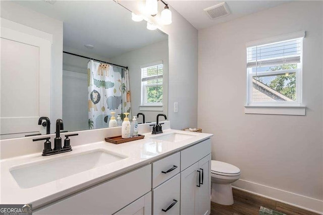 338 Boundless Ln, Canton, GA 30114 - bathroom with double vanity, wood finished floors, and curtained shower