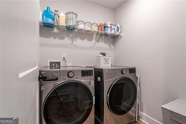 338 Boundless Ln, Canton, GA 30114 - laundry room featuring washer and clothes dryer and baseboards
