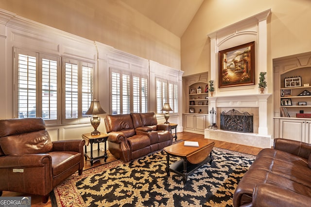 2403 Wistful Way, Marietta, GA 30066 - living area with wood finished floors, built in features, a premium fireplace, and high vaulted ceiling