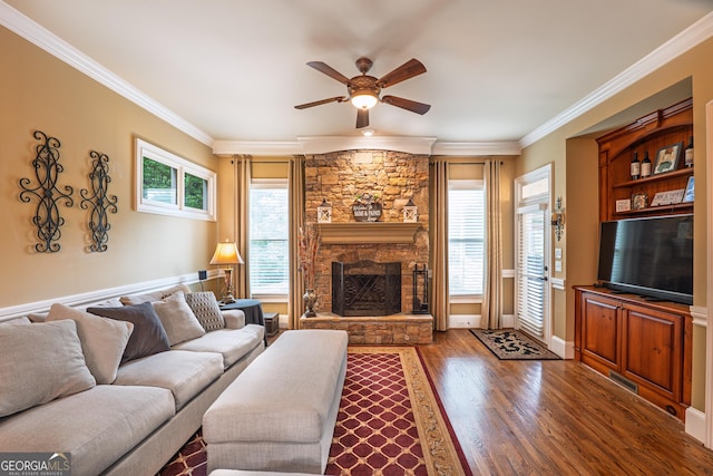 2403 Wistful Way, Marietta, GA 30066 - living area featuring ceiling fan, wood finished floors, crown molding, and a stone fireplace