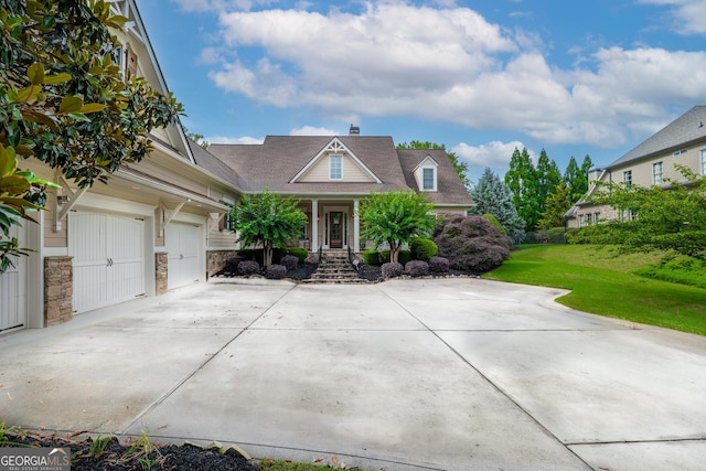 2403 Wistful Way, Marietta, GA 30066 - view of front facade featuring concrete driveway, a front yard, a porch, a chimney, and stone siding
