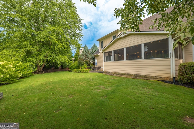 2403 Wistful Way, Marietta, GA 30066 - view of grassy yard with a sunroom and a patio area
