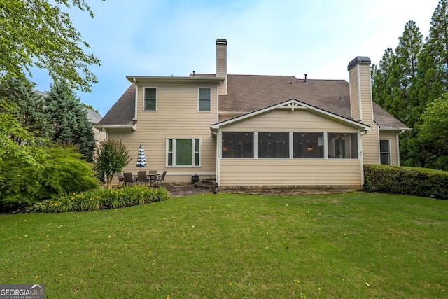 2403 Wistful Way, Marietta, GA 30066 - back of property with a sunroom, a chimney, a lawn, and a patio area