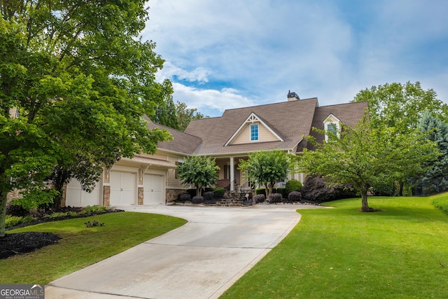 2403 Wistful Way, Marietta, GA 30066 - view of front of house with a porch, a front lawn, concrete driveway, a chimney, and stone siding