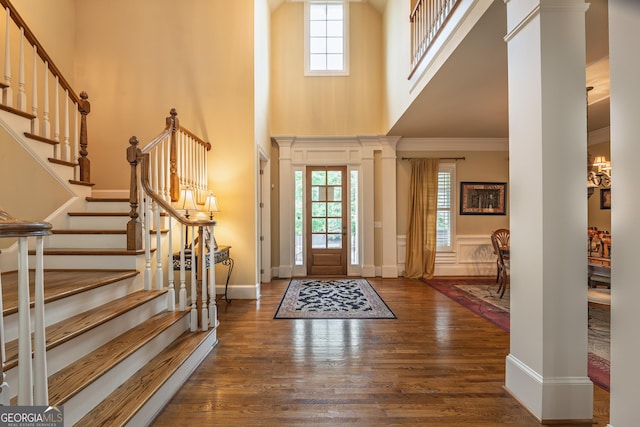 2403 Wistful Way, Marietta, GA 30066 - entrance foyer with wood finished floors, a high ceiling, healthy amount of natural light, ornamental molding, and stairway