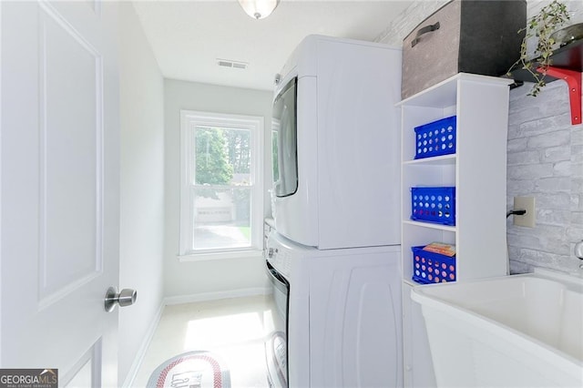 4180 Pineset Dr, Alpharetta, GA 30022 - washroom featuring stacked washer / dryer and baseboards
