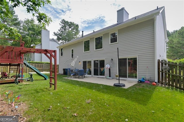 4180 Pineset Dr, Alpharetta, GA 30022 - back of house featuring a patio area, a fenced backyard, a playground, and a chimney