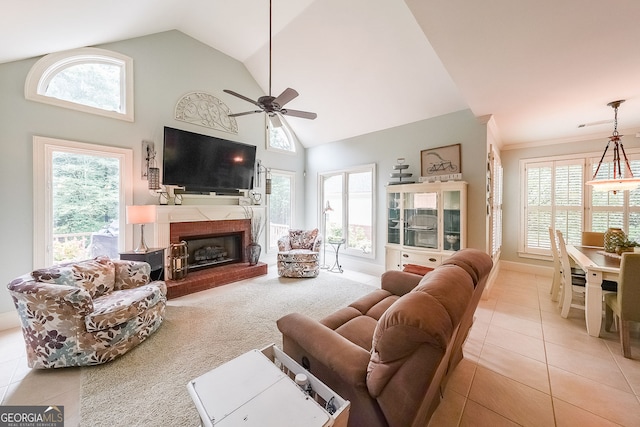 750 Old Loganville Rd SW, Loganville, GA 30052 - living area with a ceiling fan, light tile patterned floors, healthy amount of natural light, a fireplace, and high vaulted ceiling