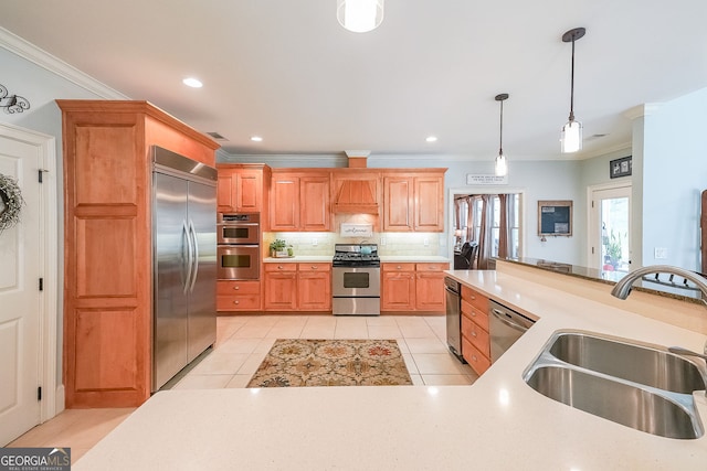 750 Old Loganville Rd SW, Loganville, GA 30052 - kitchen featuring appliances with stainless steel finishes, crown molding, hanging light fixtures, backsplash, and light countertops