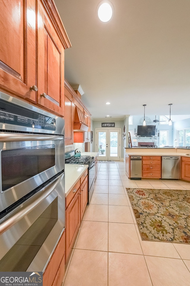 750 Old Loganville Rd SW, Loganville, GA 30052 - kitchen with appliances with stainless steel finishes, french doors, light countertops, light tile patterned floors, and recessed lighting