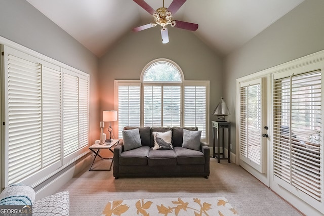 750 Old Loganville Rd SW, Loganville, GA 30052 - living area featuring a ceiling fan, vaulted ceiling, and light colored carpet